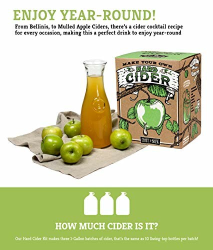 Hard cider kit with green apples and cider jug.
